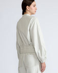 Zoe Jacket in Silver – 100% cotton jacket with flap patch pockets, hidden buttons, long sleeves, and an adjustable drawstring hem.