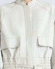 Zoe Jacket in Silver – 100% cotton jacket with flap patch pockets, hidden buttons, long sleeves, and an adjustable drawstring hem.