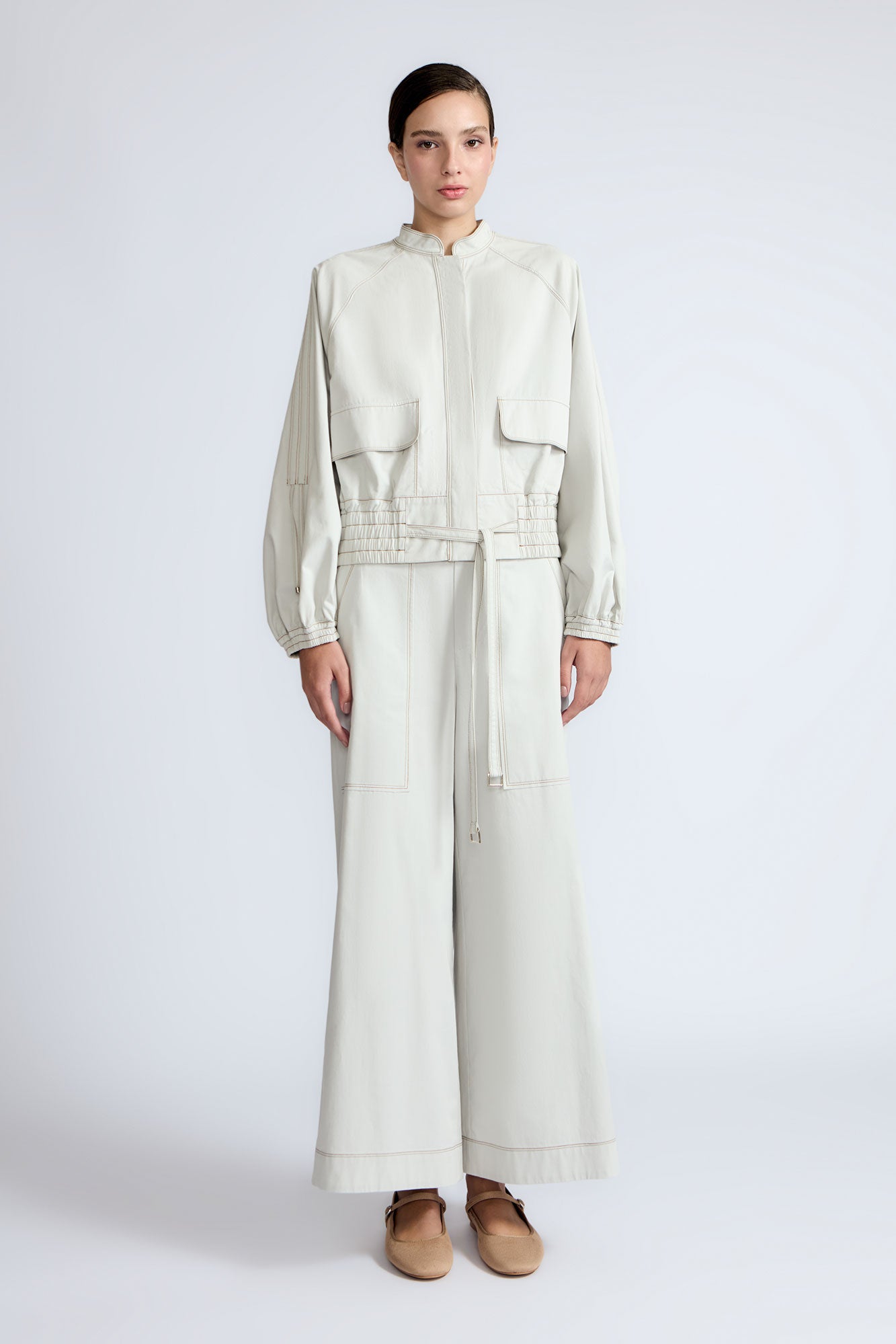 Zoe Pant in Silver – High-waisted cotton pants with front and back patch pockets, wide legs, contrast stitching, and side vents.