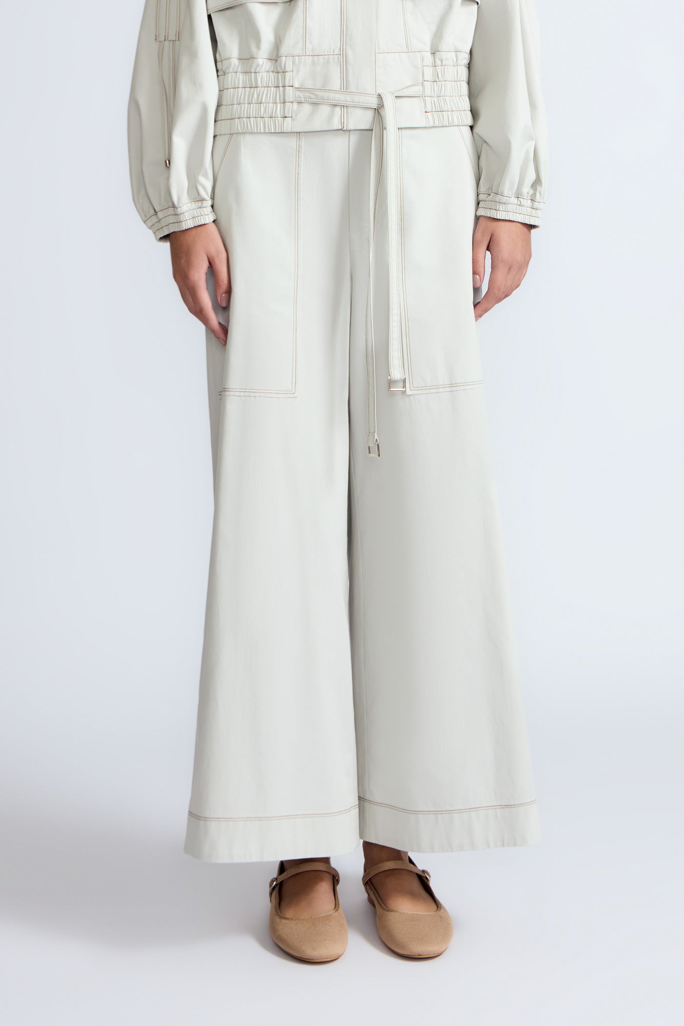 Zoe Pant in Silver – High-waisted cotton pants with front and back patch pockets, wide legs, contrast stitching, and side vents.