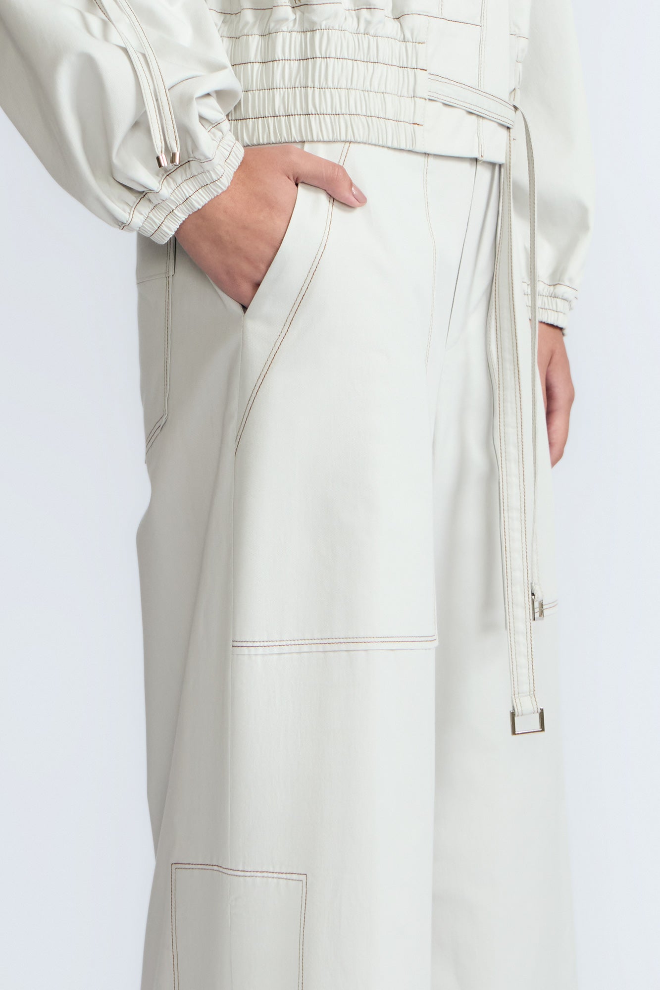 Zoe Pant in Silver – High-waisted cotton pants with front and back patch pockets, wide legs, contrast stitching, and side vents.