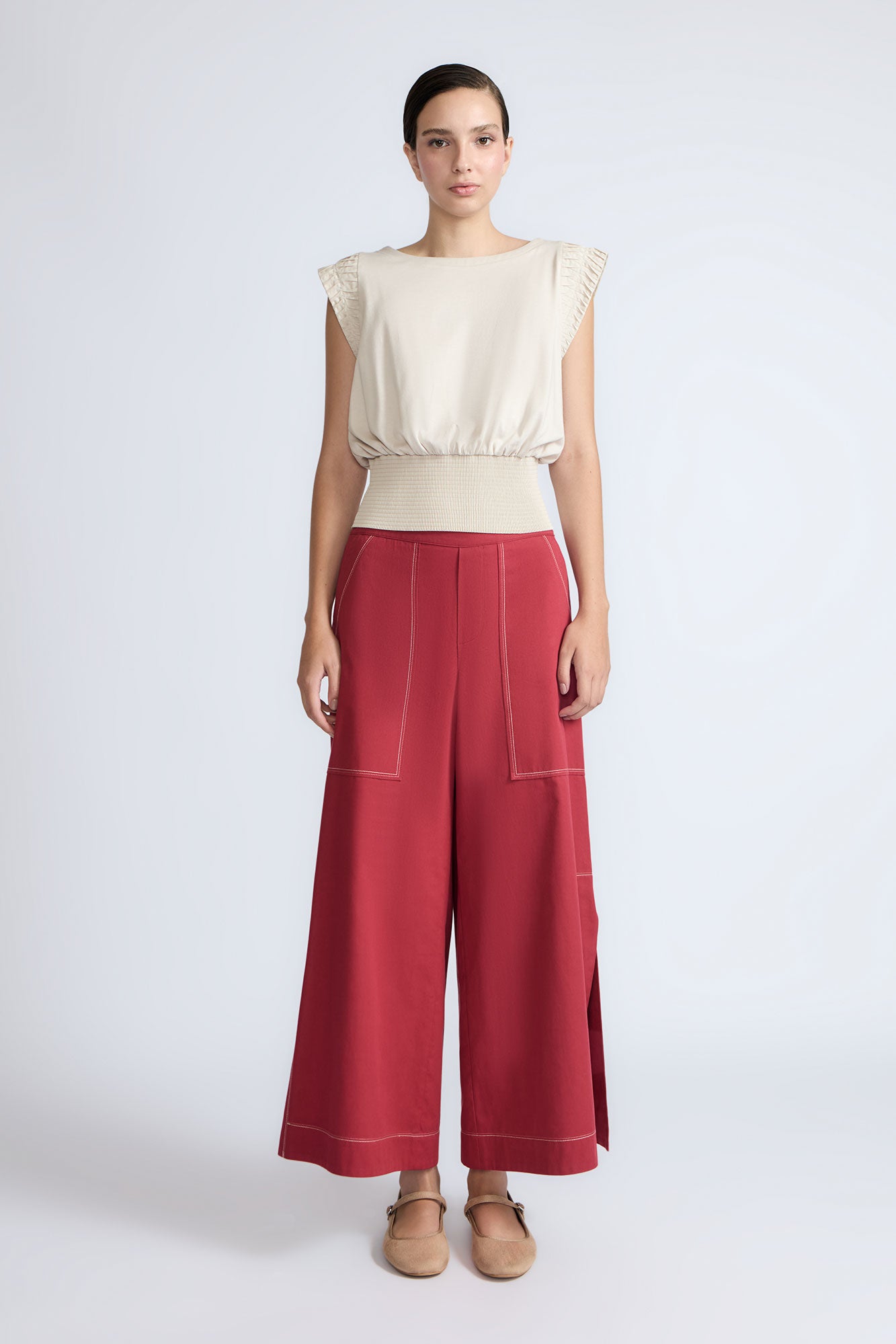 Zoe Pant in Wine – High-waisted wide-leg pants with front and back patch pockets, contrast stitching, and side vents.