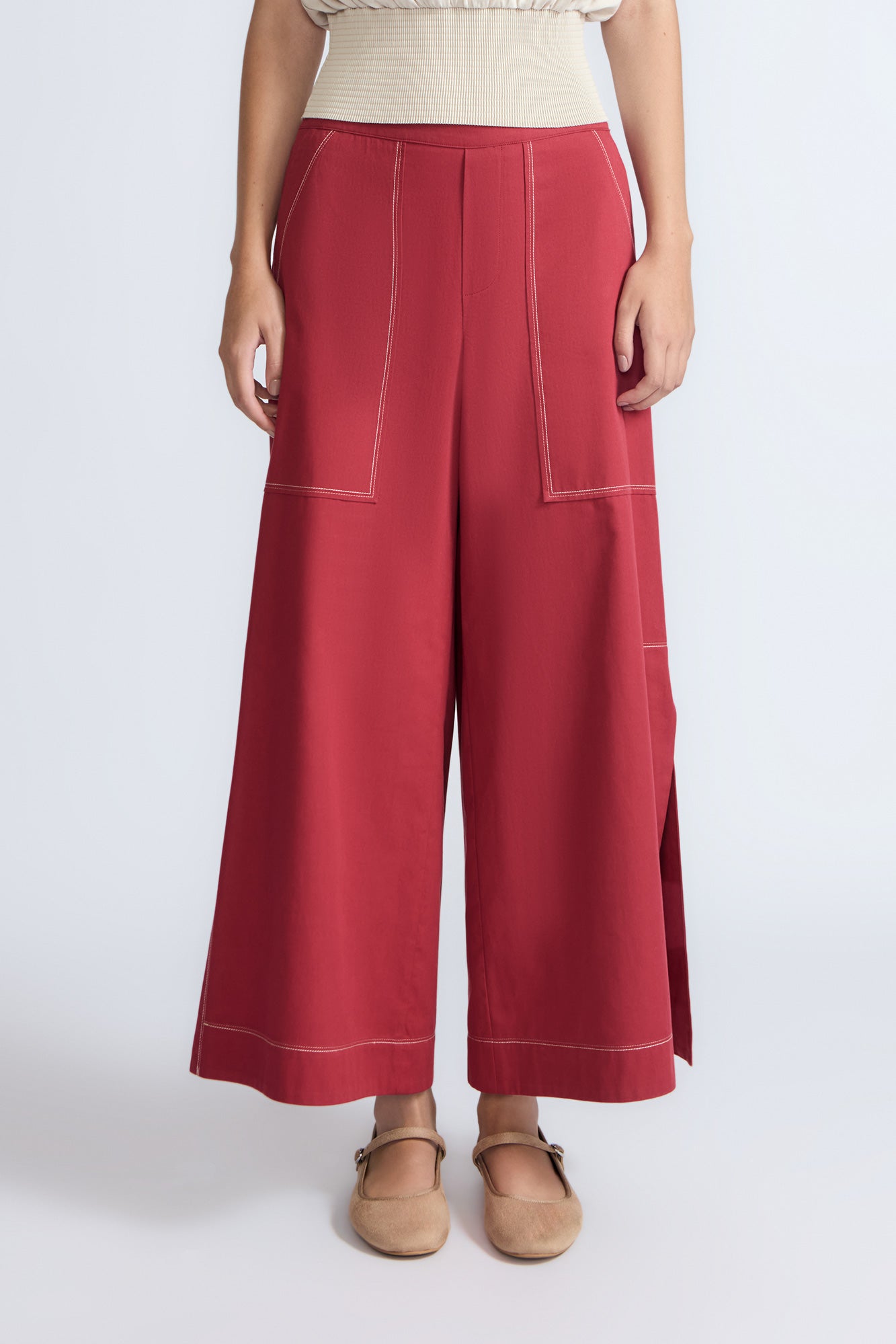 Zoe Pant in Wine – High-waisted wide-leg pants with front and back patch pockets, contrast stitching, and side vents.