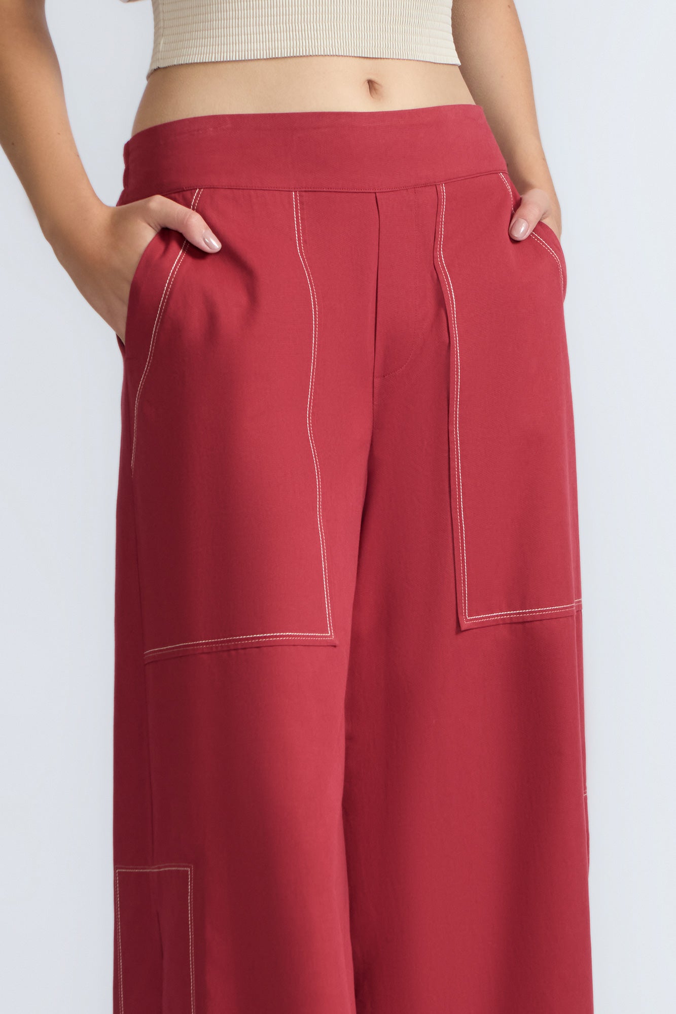 Zoe Pant in Wine – High-waisted wide-leg pants with front and back patch pockets, contrast stitching, and side vents.