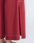 Zoe Pant in Wine – High-waisted wide-leg pants with front and back patch pockets, contrast stitching, and side vents.