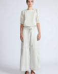 Zoila Pant in Silver – High-waisted cotton palazzo pants with metal buckle belt, back patch pockets, and contrast stitching.