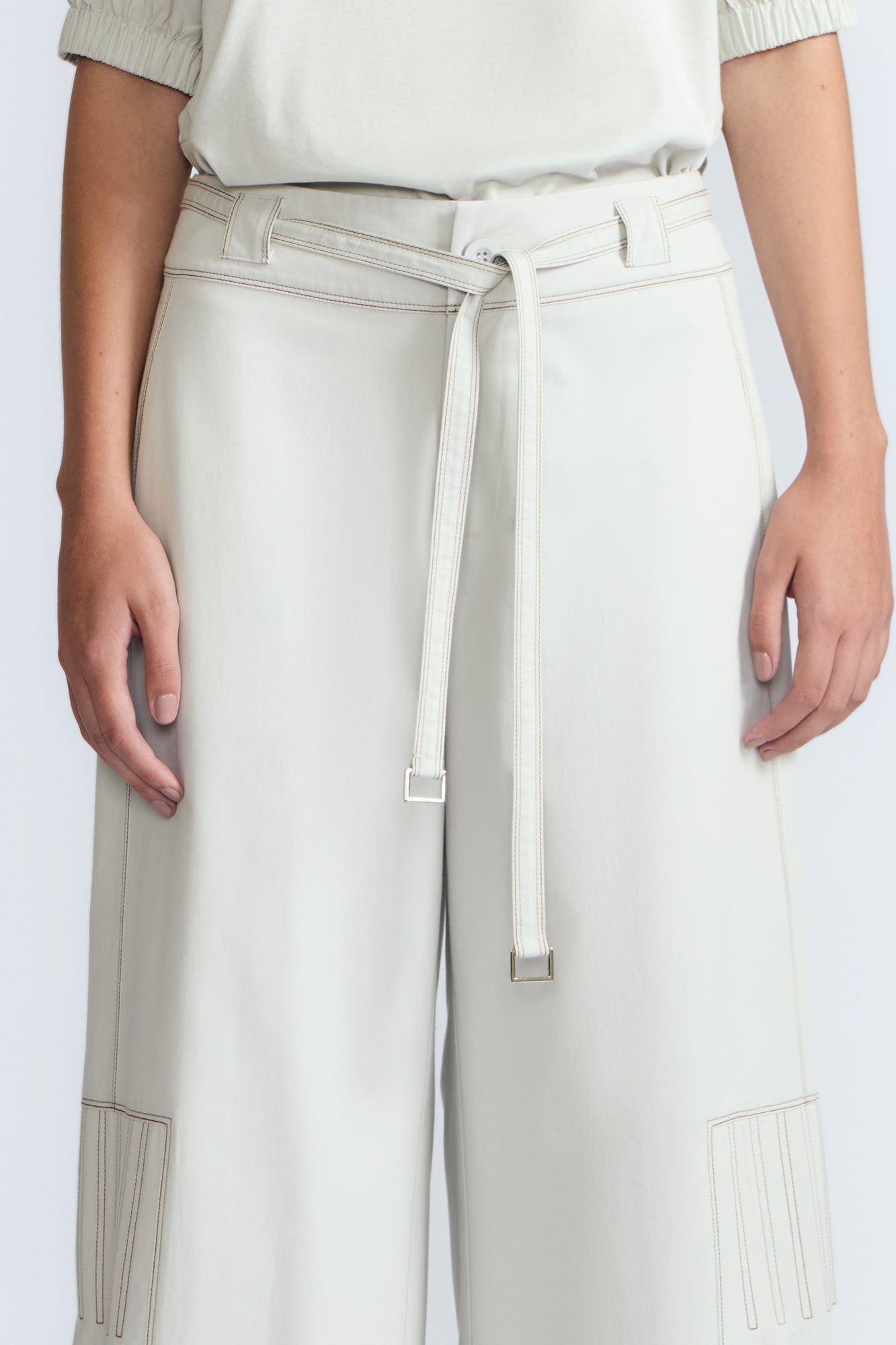 Zoila Pant in Silver – High-waisted cotton palazzo pants with metal buckle belt, back patch pockets, and contrast stitching.