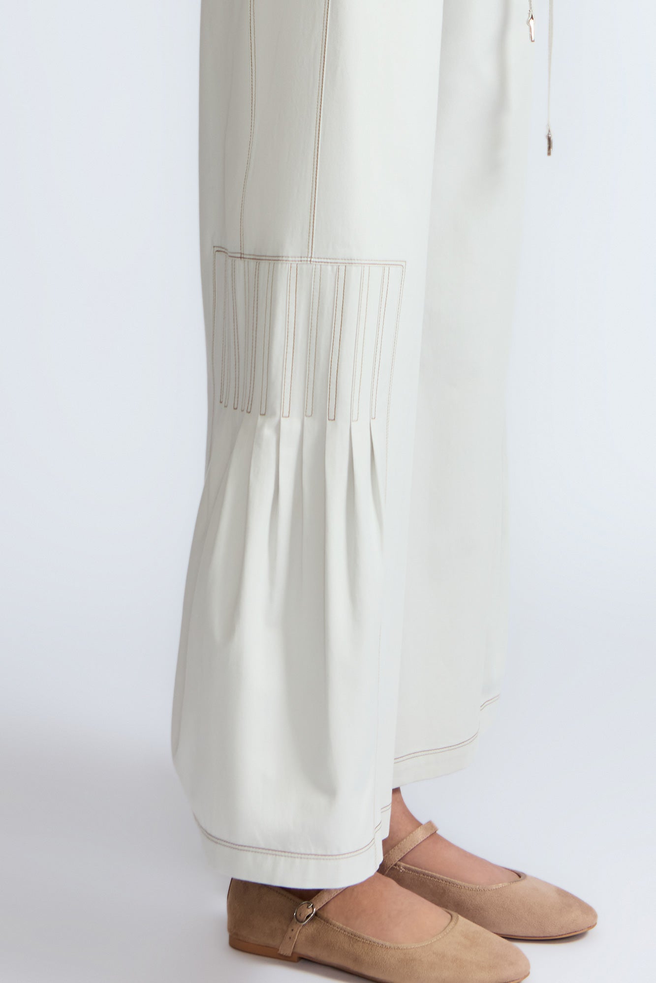 Zoila Pant in Silver – High-waisted cotton palazzo pants with metal buckle belt, back patch pockets, and contrast stitching.