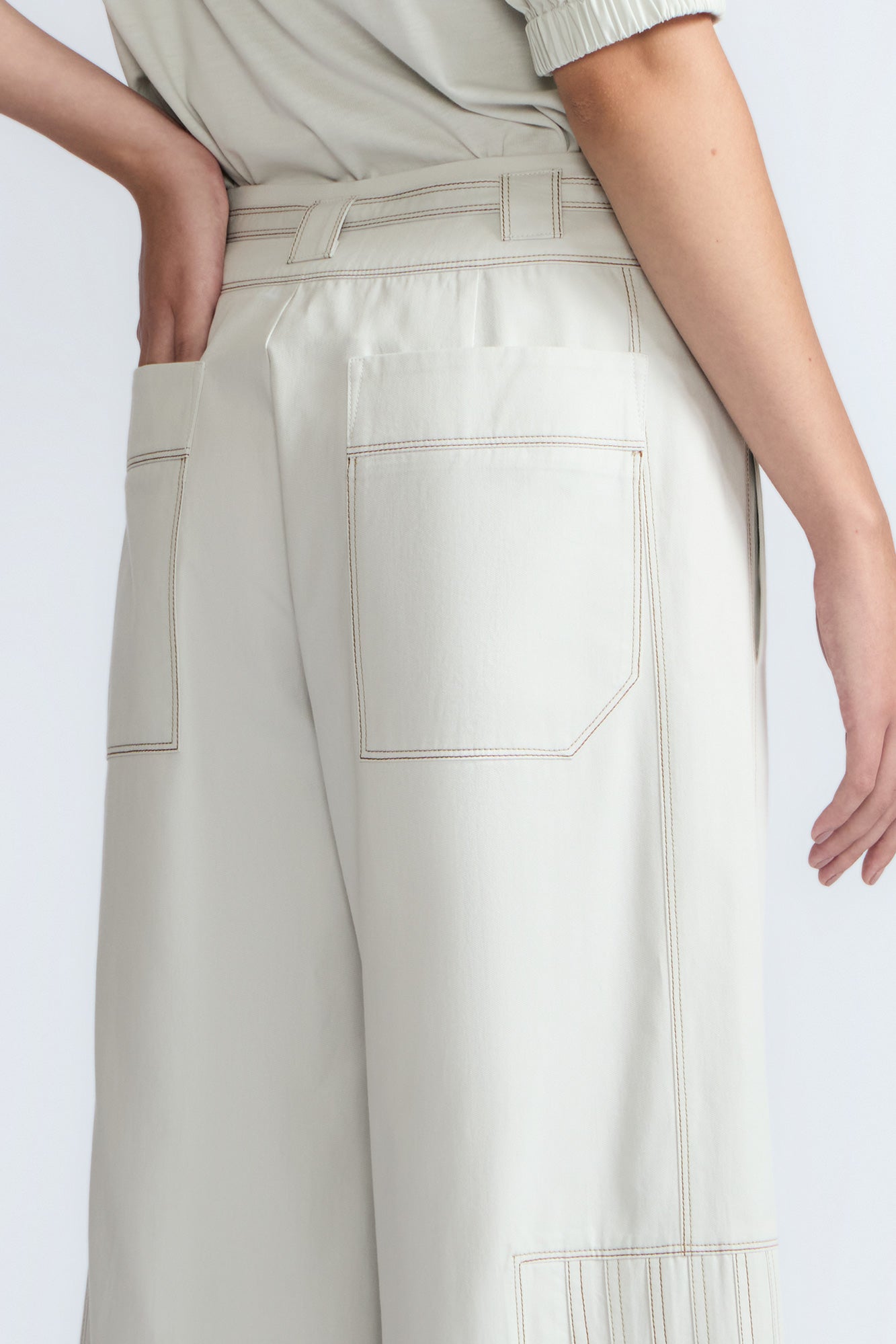 Zoila Pant in Silver – High-waisted cotton palazzo pants with metal buckle belt, back patch pockets, and contrast stitching.
