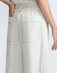 Zoila Pant in Silver – High-waisted cotton palazzo pants with metal buckle belt, back patch pockets, and contrast stitching.