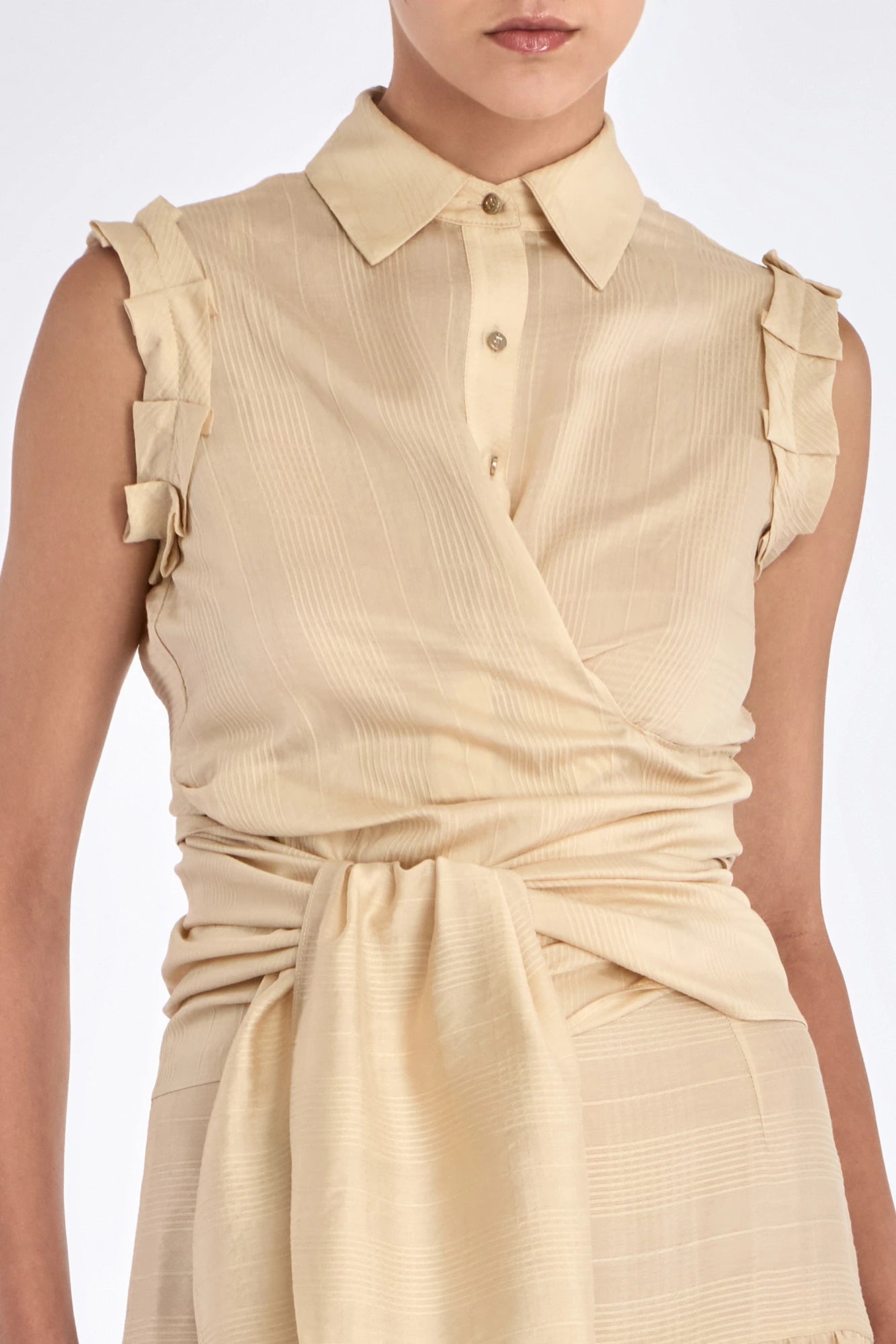 Front view of the Harlow Wrap Blouse in a soft vanilla color.