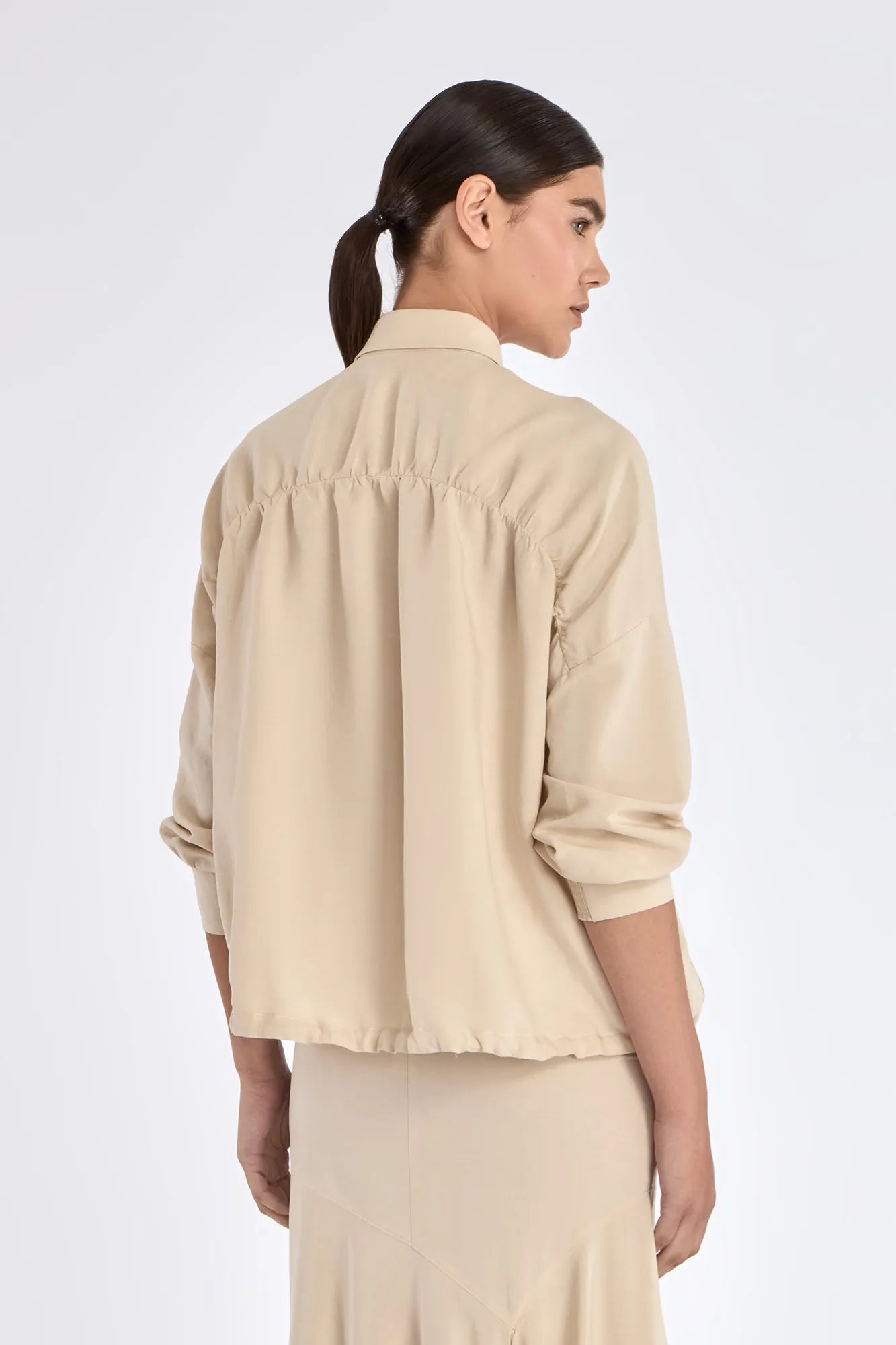 The gathered back detail of the Ailani Jacket, showcasing its elegant volume.