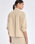The gathered back detail of the Ailani Jacket, showcasing its elegant volume.