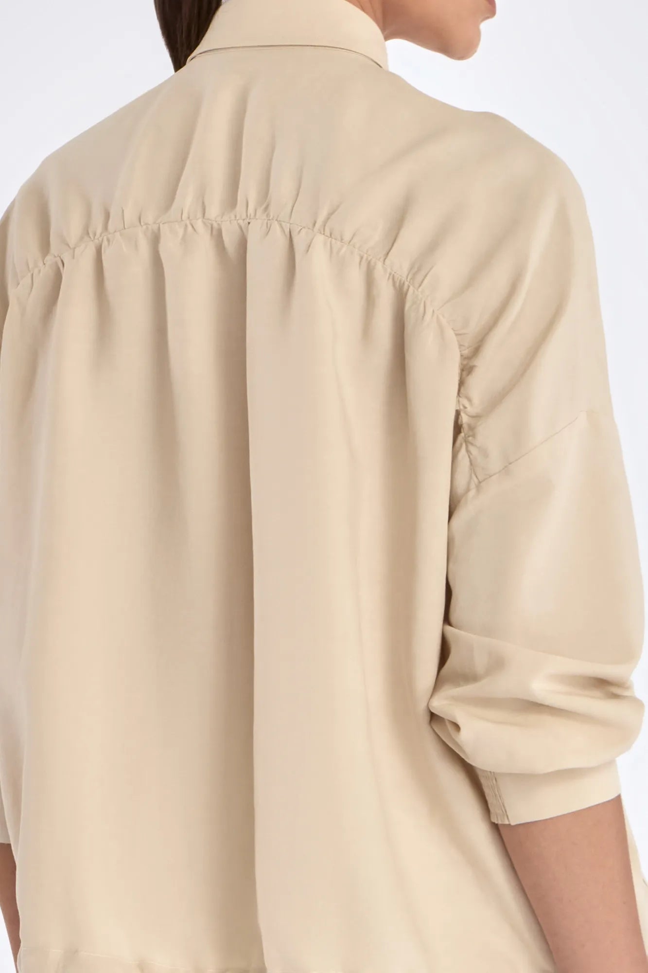 The gathered back detail of the Ailani Jacket, showcasing its elegant volume.