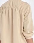 The gathered back detail of the Ailani Jacket, showcasing its elegant volume.