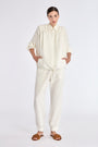 Ailani Jacket in Off White – Viscose-linen shirt collar jacket with hidden pockets, gathered back, and adjustable drawstring placket.