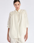 Ailani Jacket in Off White – Viscose-linen shirt collar jacket with hidden pockets, gathered back, and adjustable drawstring placket.