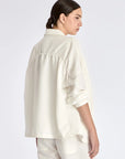 The soft volume of the gathered back panel on the Ailani Jacket in Off White.