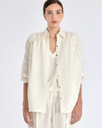 Ailani Jacket in Off White – Viscose-linen shirt collar jacket with hidden pockets, gathered back, and adjustable drawstring placket.