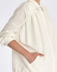 Ailani Jacket in Off White – Viscose-linen shirt collar jacket with hidden pockets, gathered back, and adjustable drawstring placket.