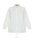 The Ailani Jacket in Off White, highlighting its clean architectural lines and drawstring detail.