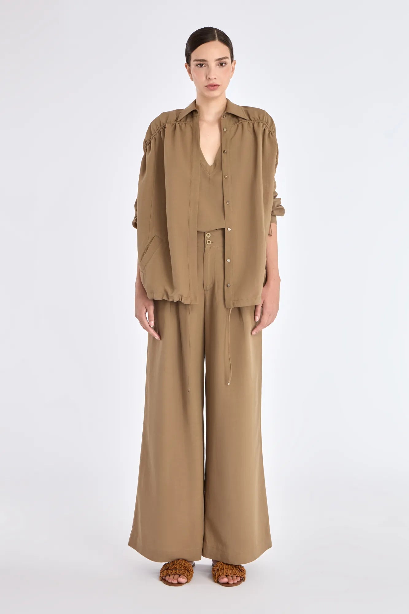 Front view of the Ailani Jacket in Taupe, showcasing its shirt collar and unique drawstring placket.