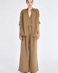 Front view of the Ailani Jacket in Taupe, showcasing its shirt collar and unique drawstring placket.