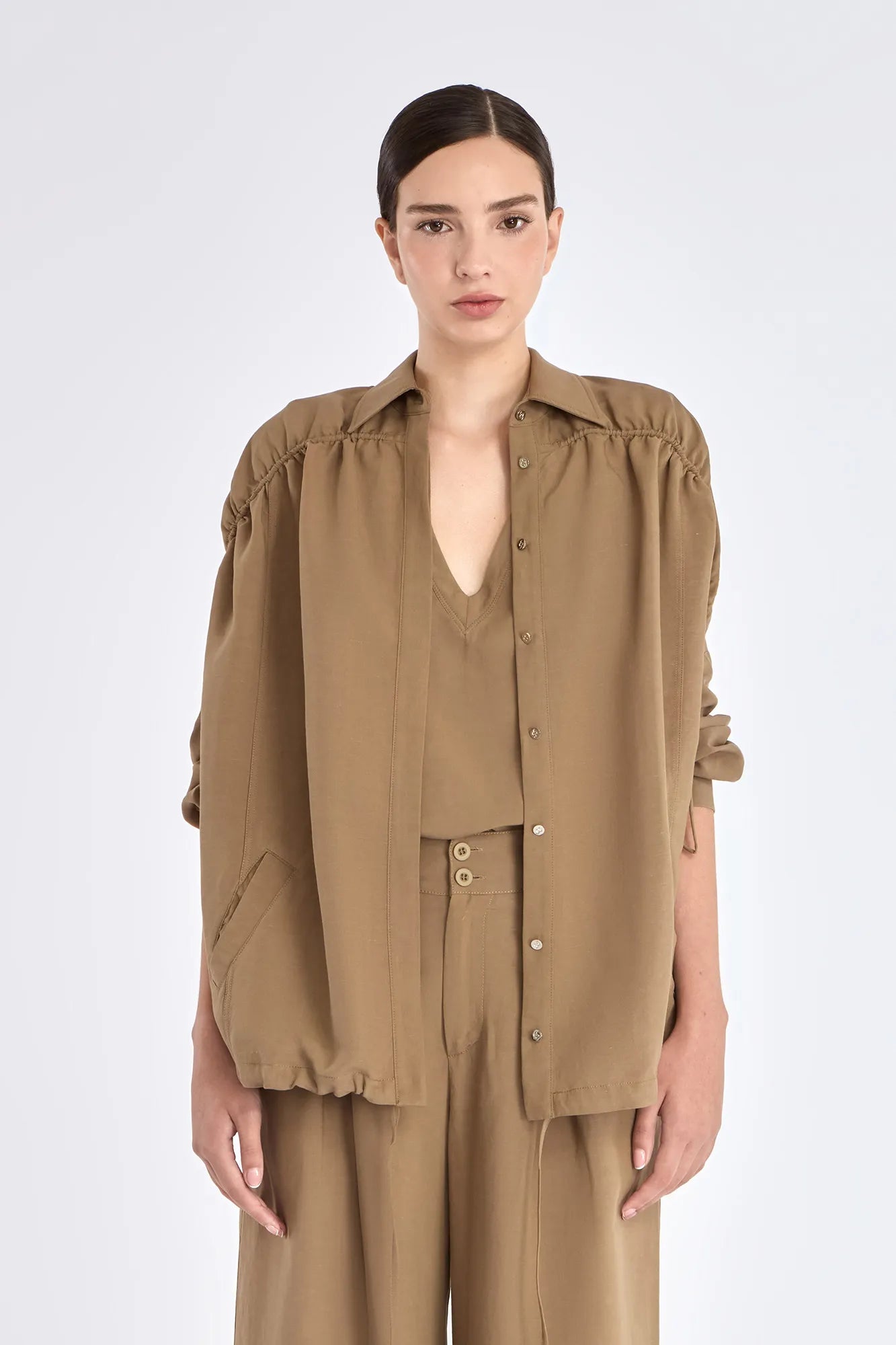 Front view of the Ailani Jacket in Taupe, showcasing its shirt collar and unique drawstring placket.