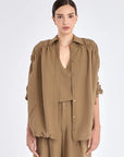 Front view of the Ailani Jacket in Taupe, showcasing its shirt collar and unique drawstring placket.