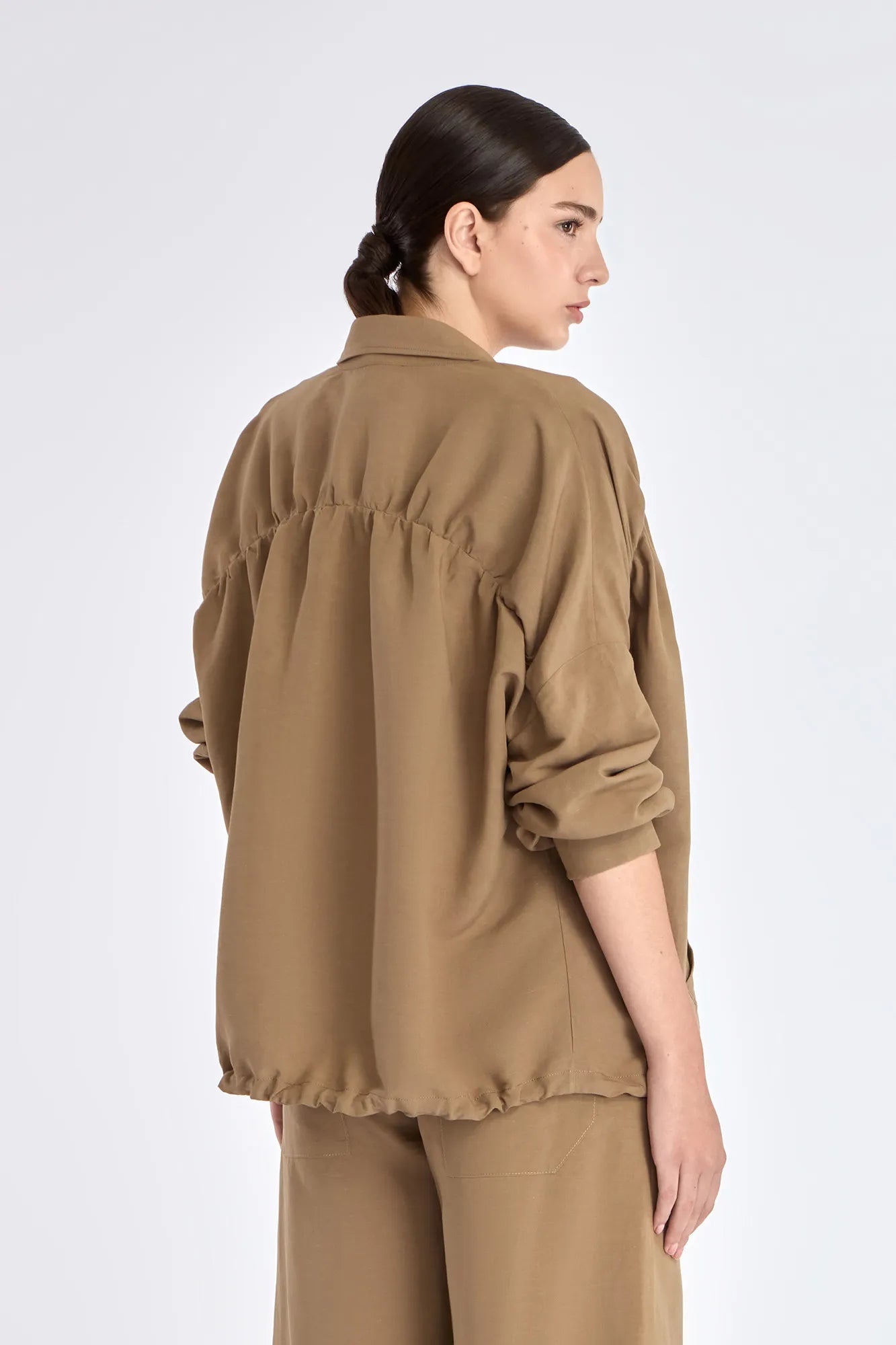 Back view of the Ailani Jacket, detailing the elegant, gathered back panel.