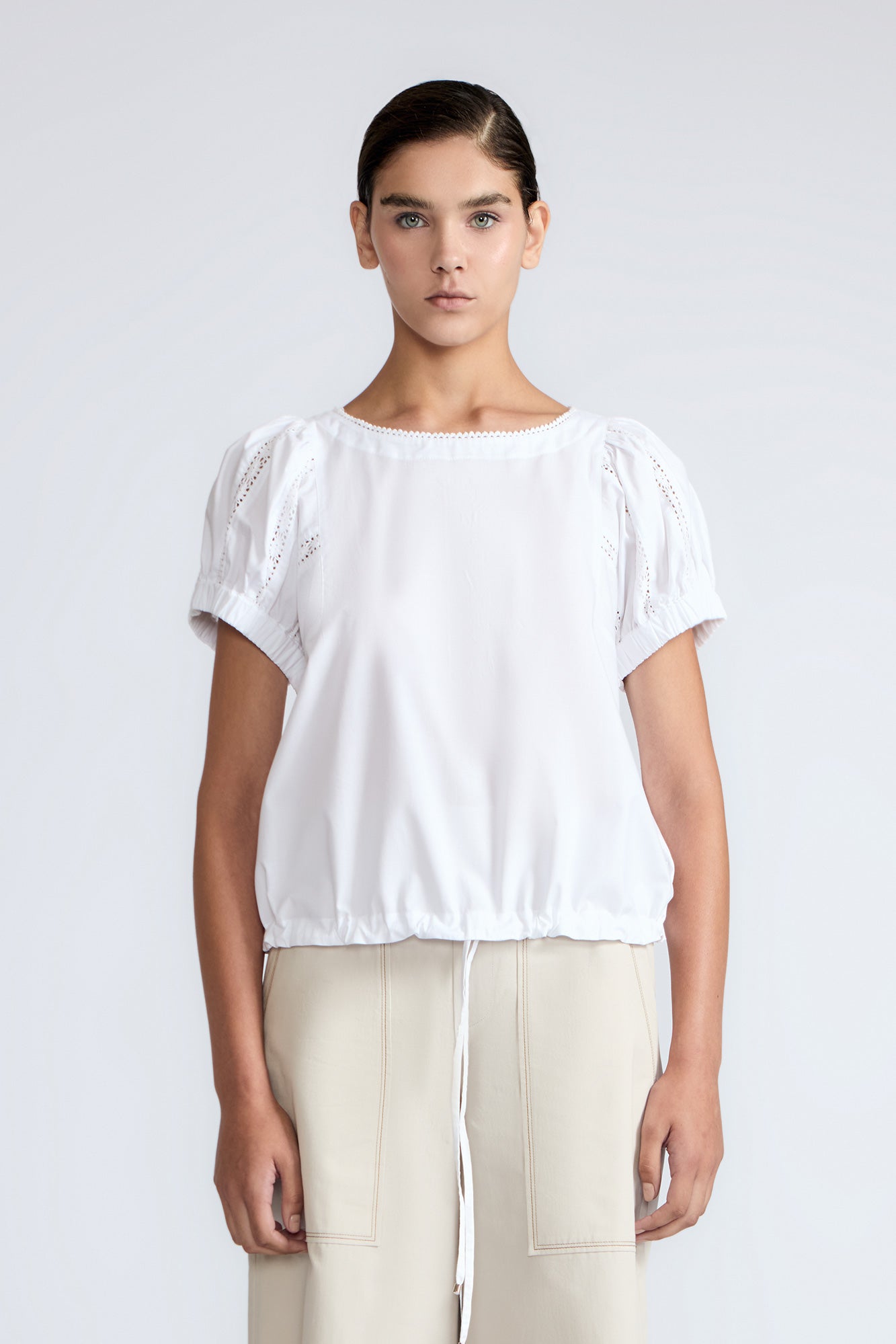 Amara blouse in white with broderie appliques and adjustable drawstring