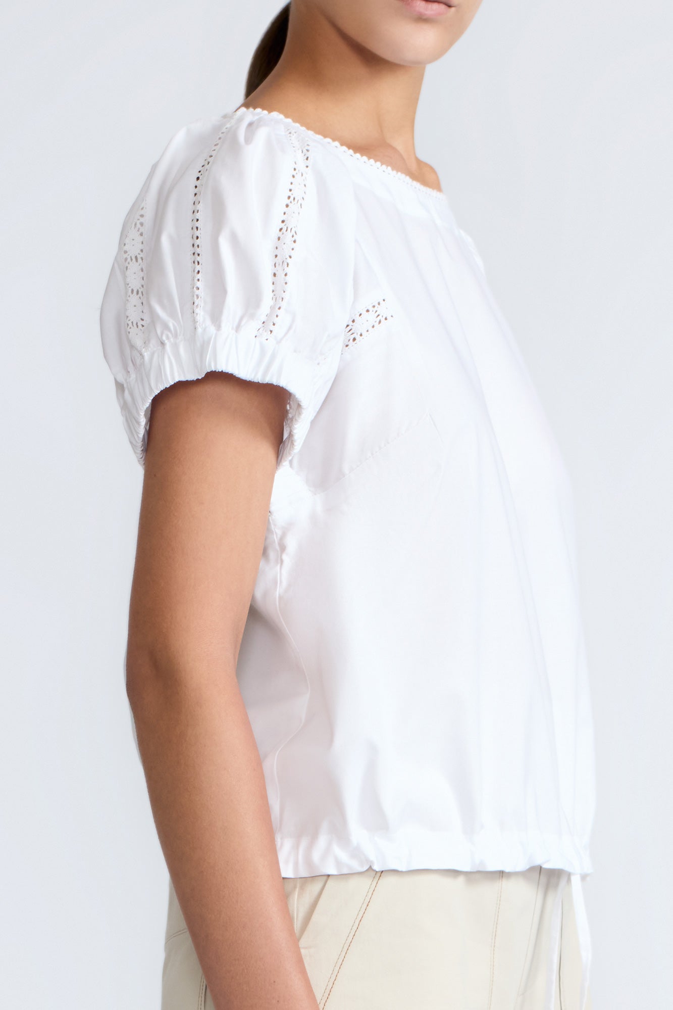 Amara blouse in white with broderie appliques and adjustable drawstring