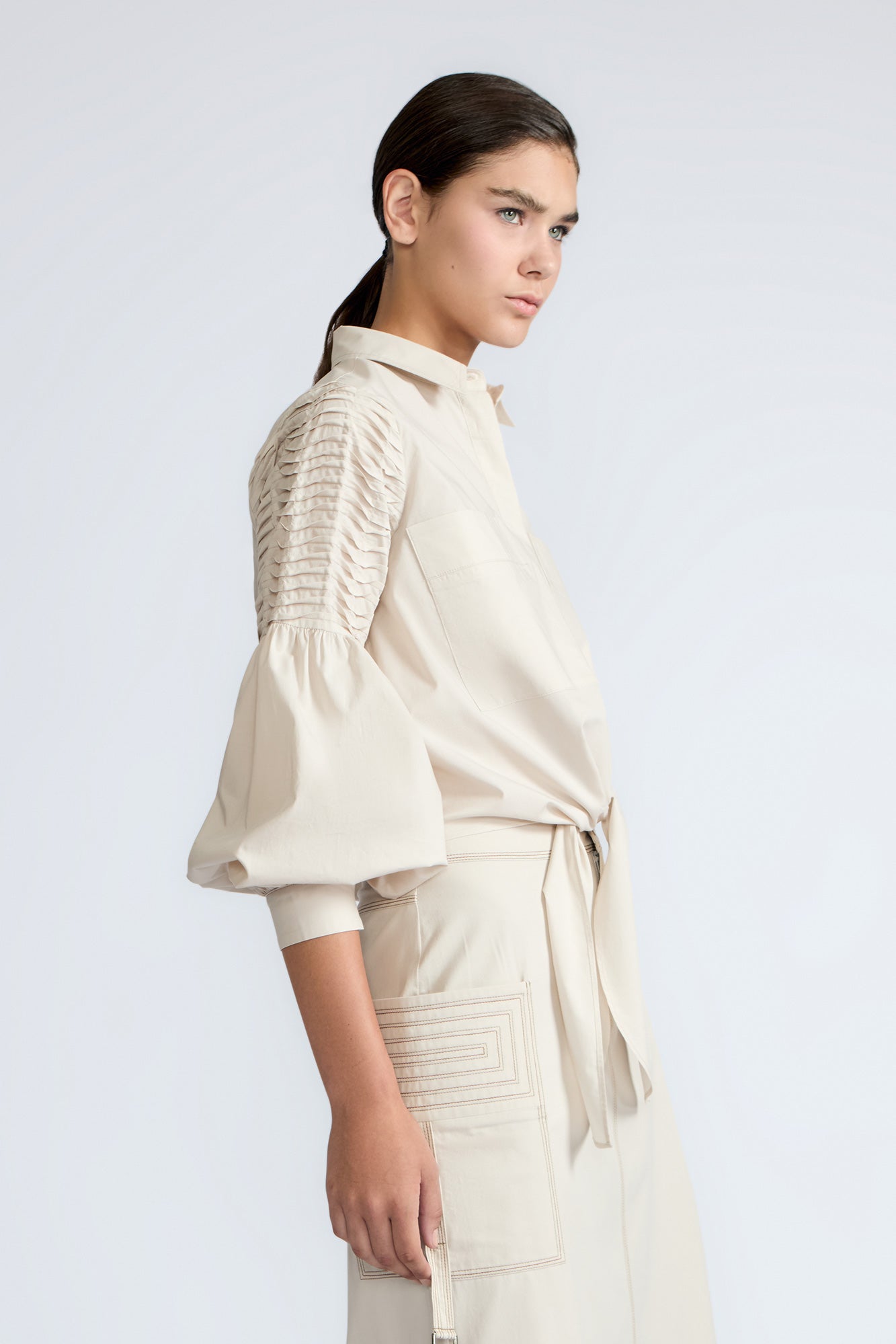 Ansley Blouse in Prestine – Lightweight cotton blouse with tie waist, balloon sleeves, and shirt collar.