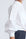 Ansley Blouse in White – Relaxed-fit cotton blouse with shirt collar, button front, and tied waist detail.