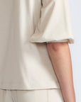 Artemisa Top in Prestine – 100% cotton top with round neckline, wrap tie at the waist, and ¾ sleeves.