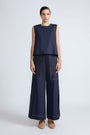 Avayah Top in Navy – 100% cotton sleeveless top with round neckline, shoulder button accents, and drawstring hem.