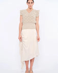 Front view of the Beca Vest in Beige Melange, showcasing the V-neckline and crochet ruffle sleeves.
