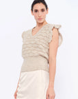 Front view of the Beca Vest in Beige Melange, showcasing the V-neckline and crochet ruffle sleeves.