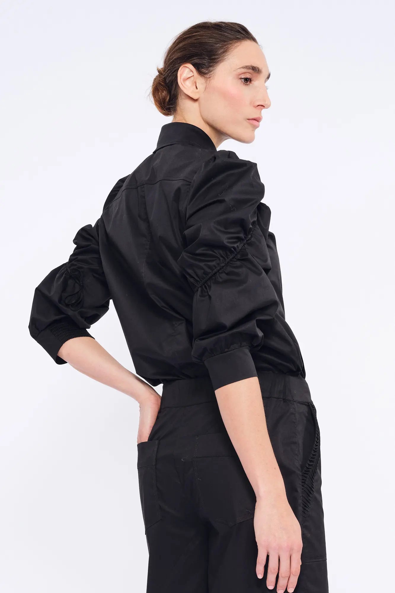 Clean back silhouette of the Bimba Blouse, crafted from premium stretch cotton.