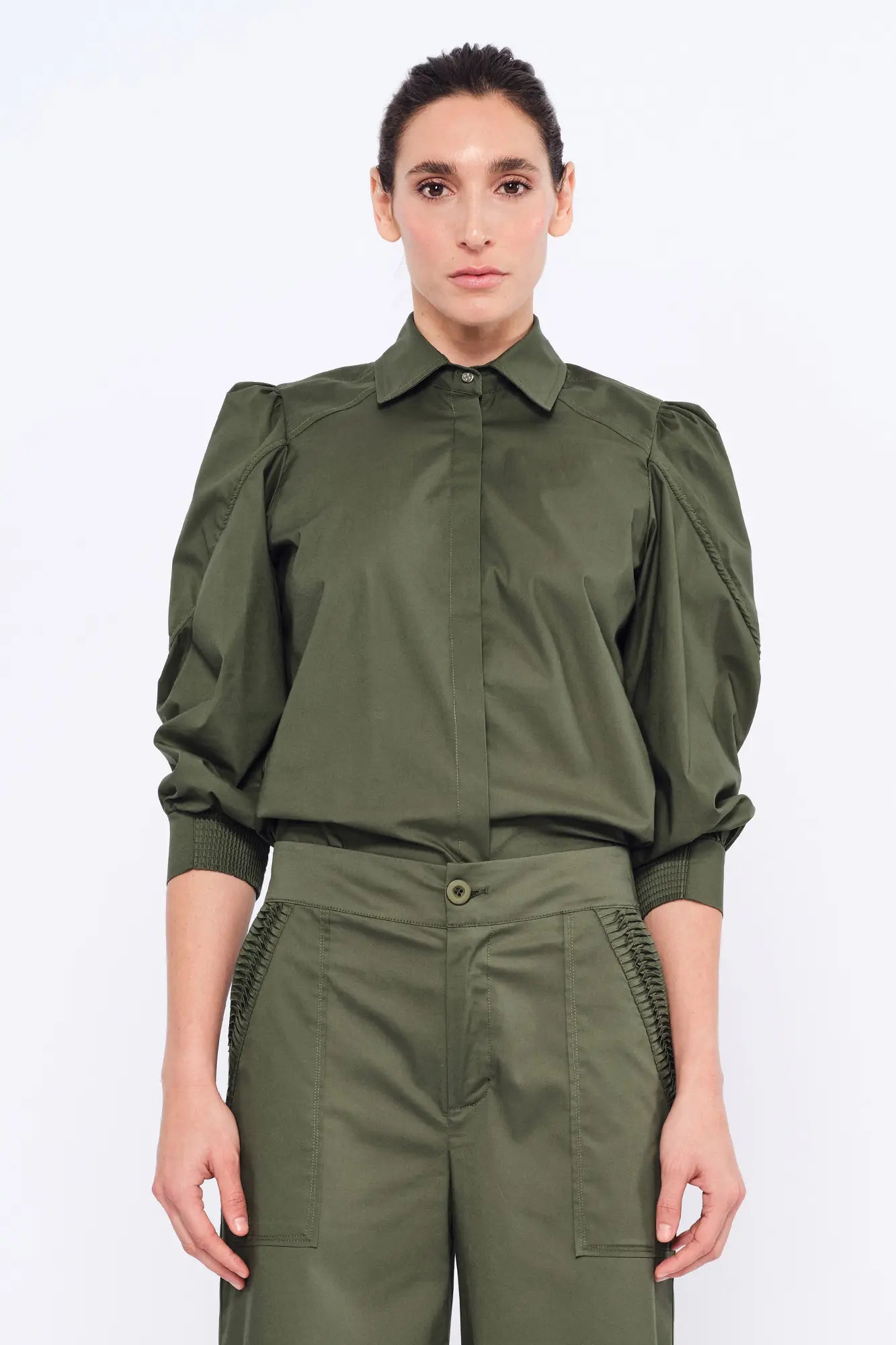 Front view of the Bimba Blouse in Olive, showcasing its classic shirt collar and relaxed silhouette.