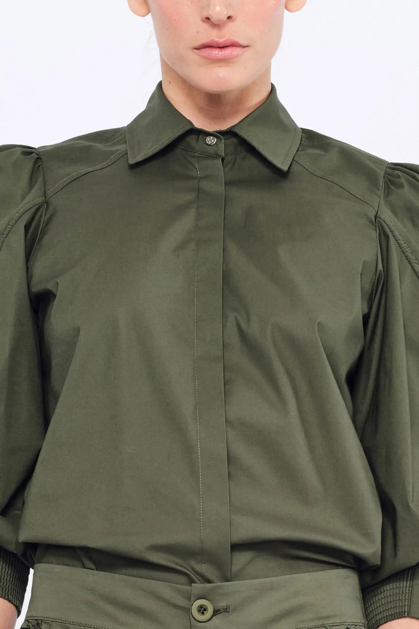 Front view of the Bimba Blouse in Olive, showcasing its classic shirt collar and relaxed silhouette.