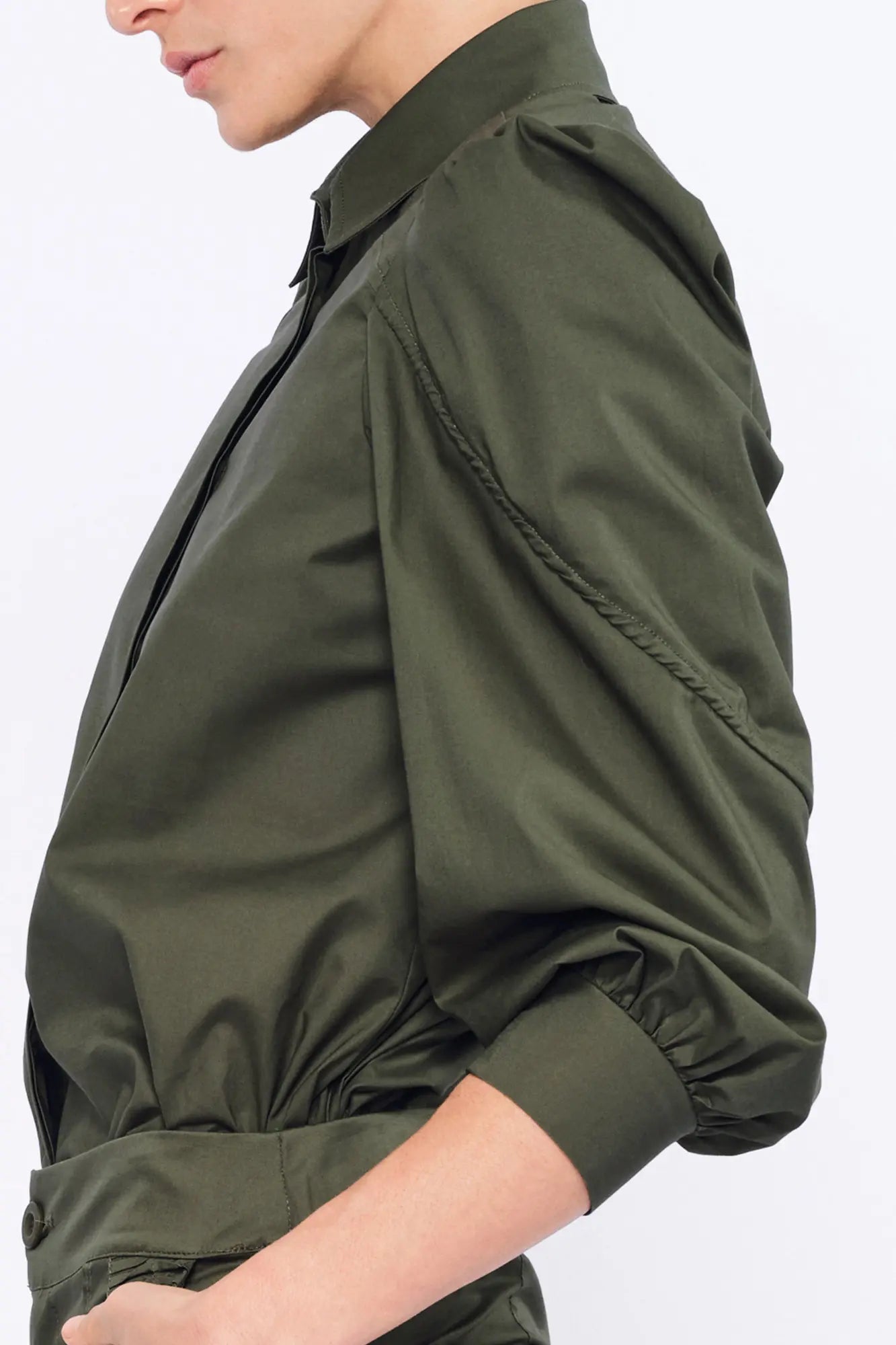Close-up of the semi-elastic cuff and the gathered fabric of the puff sleeve on the Olive Bimba Blouse.