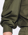 Close-up of the semi-elastic cuff and the gathered fabric of the puff sleeve on the Olive Bimba Blouse.