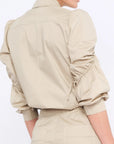 Elegant back view of the Bimba Blouse in its refined silhouette.