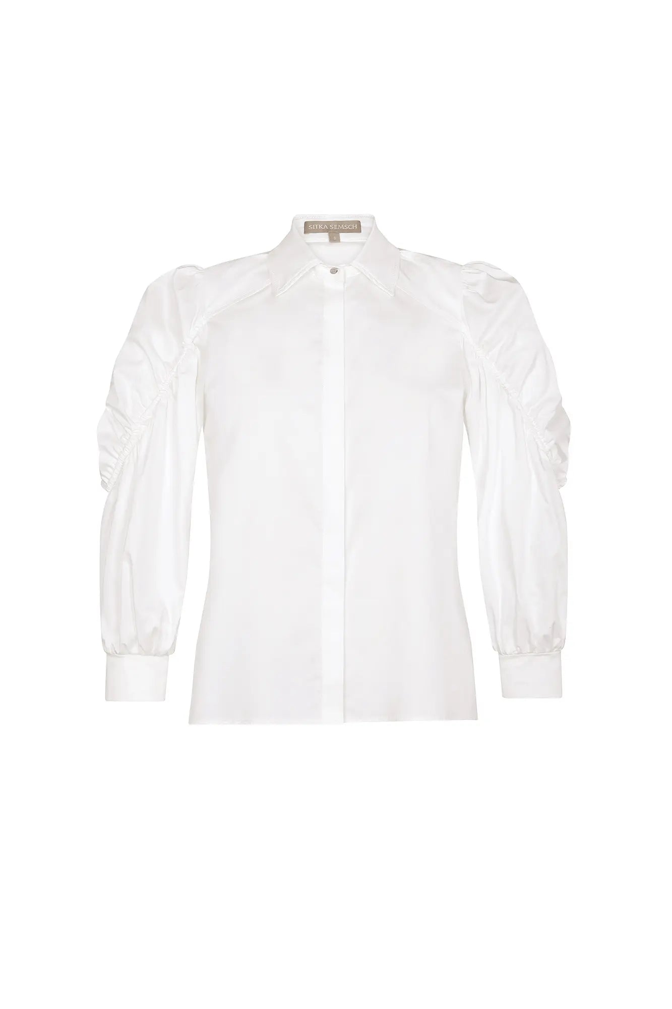 The Bimba Blouse in classic white, featuring its crisp shirt collar and relaxed fit.