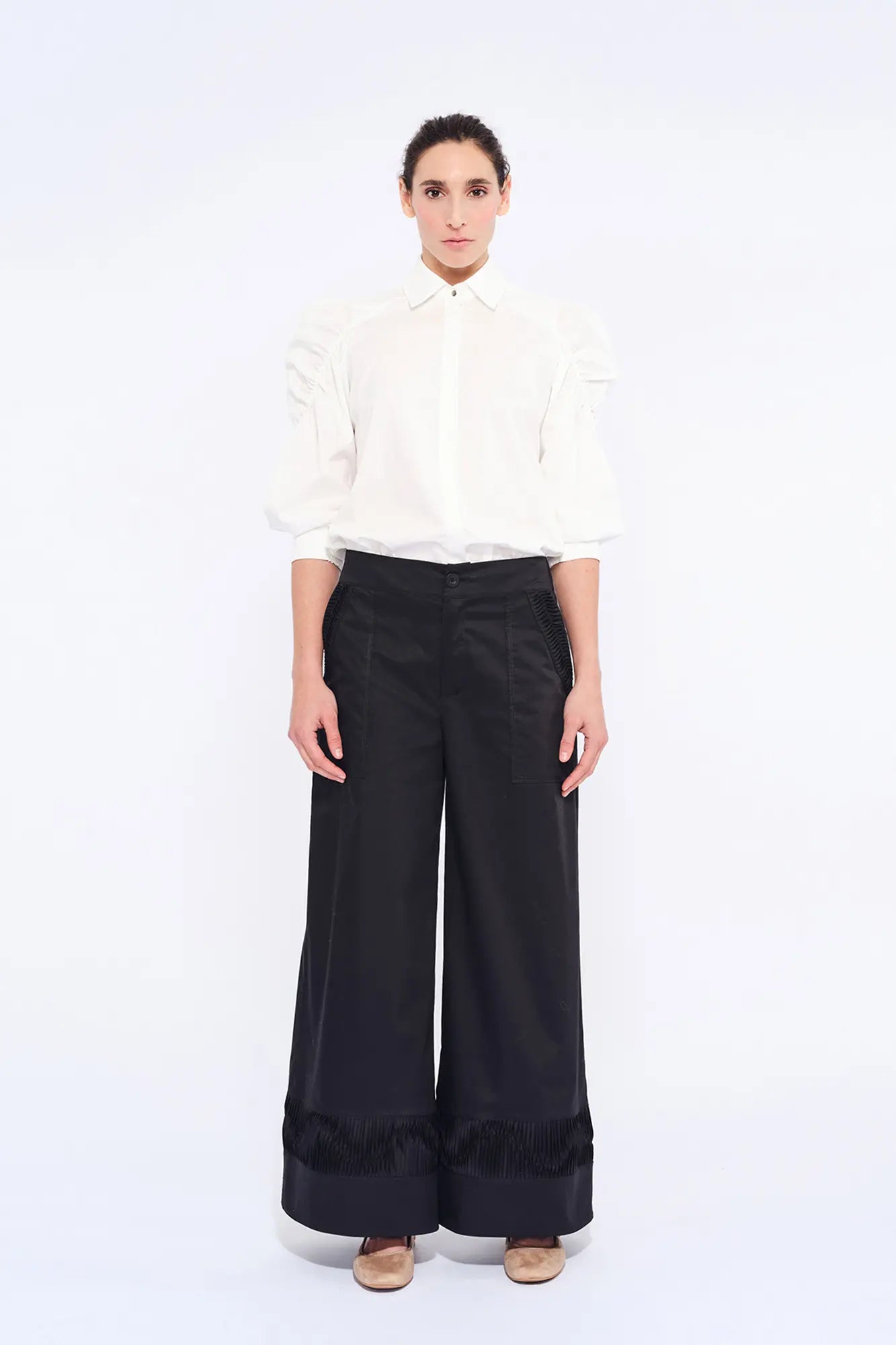 The Bimba Blouse in classic white, featuring its crisp shirt collar and relaxed fit.