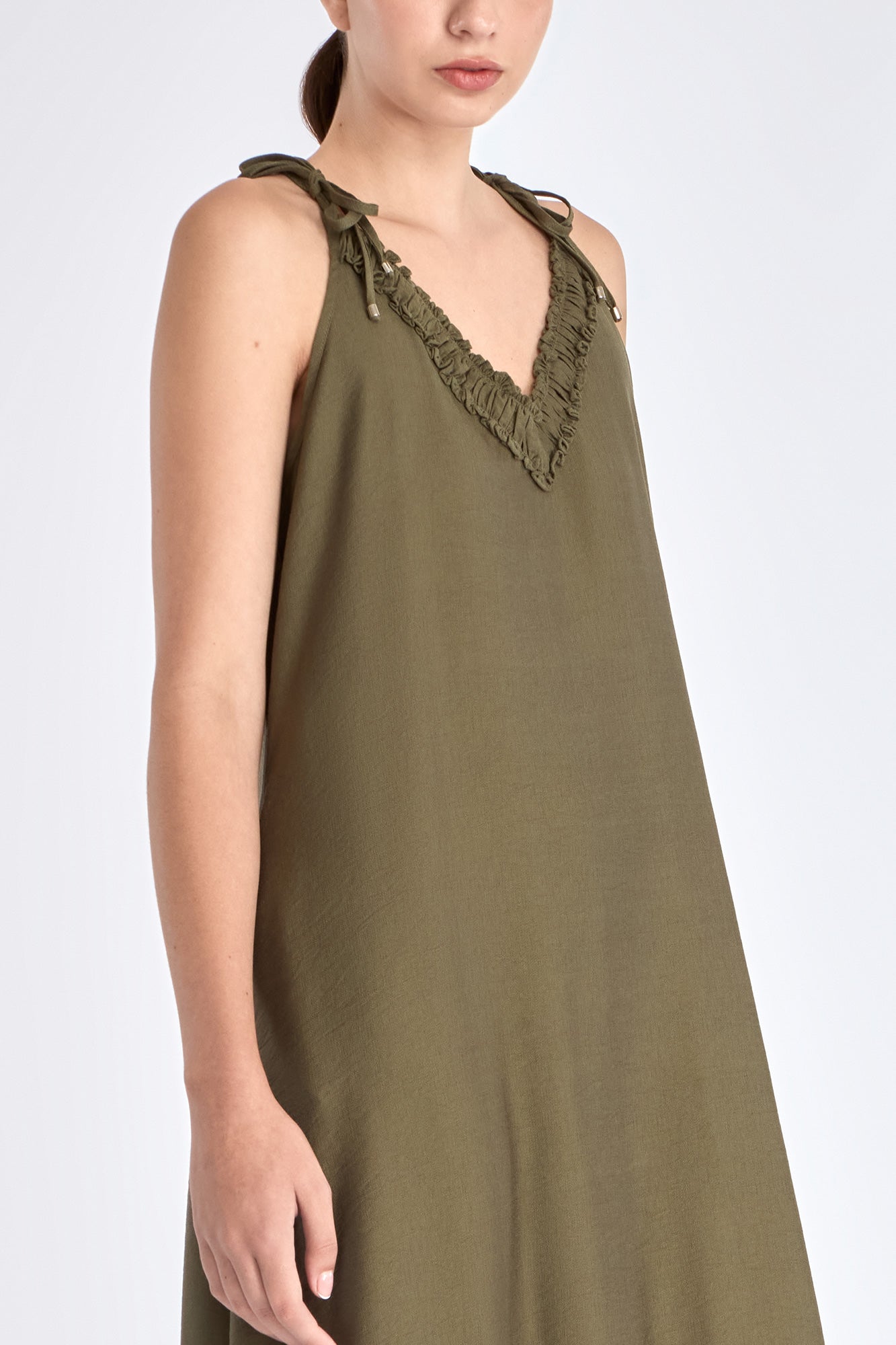 Blake Dress in Olive – Long flowy dress with double straps, soft ruffle neckline, pleated skirt, and half-elasticated back.