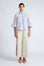 Callie Blouse – 100% cotton shirt blouse with hidden buttons, ¾ sleeves, and smocked cuffs and pockets. Made in Peru.