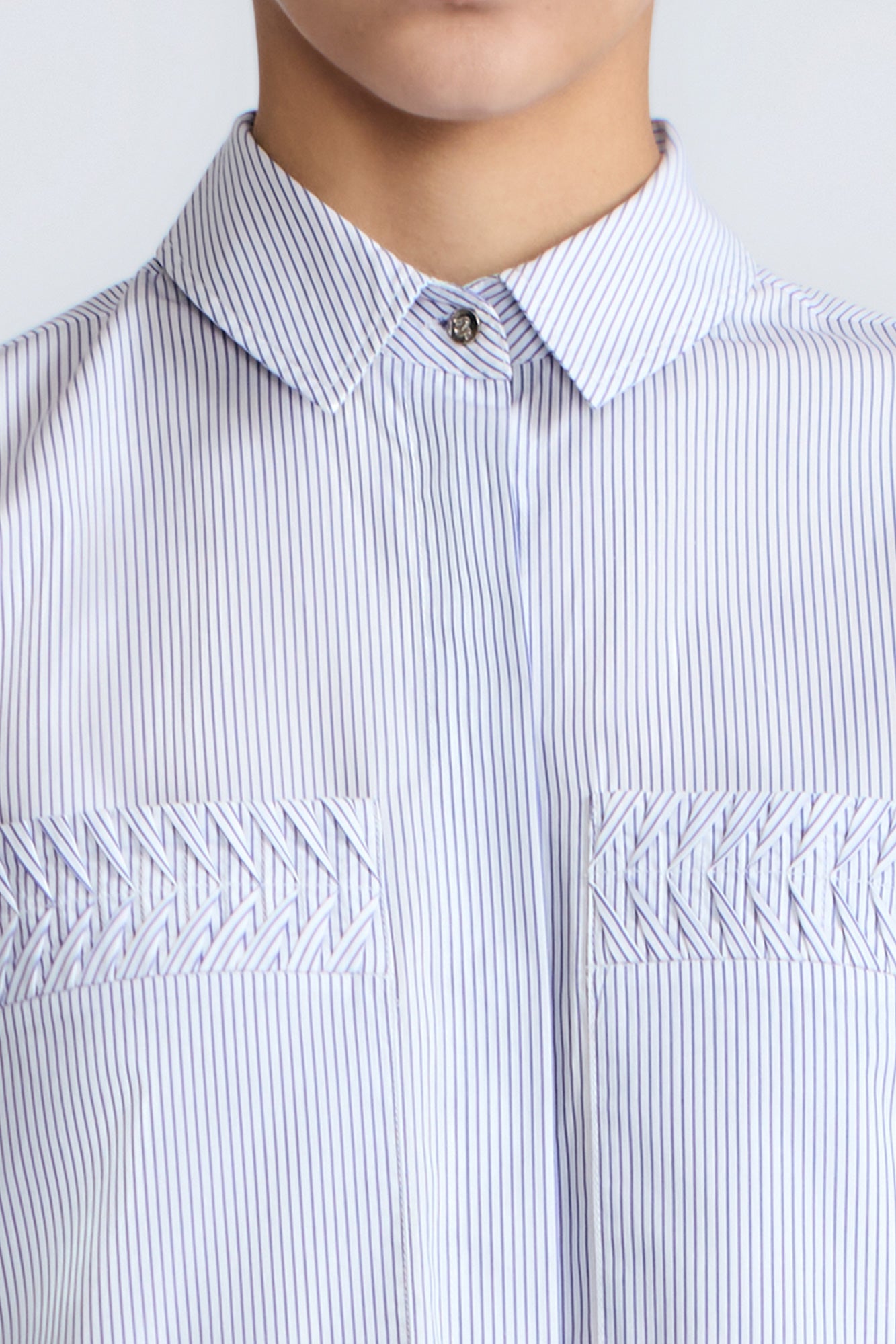 Callie Blouse – 100% cotton shirt blouse with hidden buttons, ¾ sleeves, and smocked cuffs and pockets. Made in Peru.