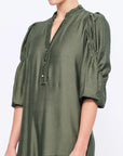Detail shot of the sculptural puff sleeve construction on the Olive Carlie Dress.